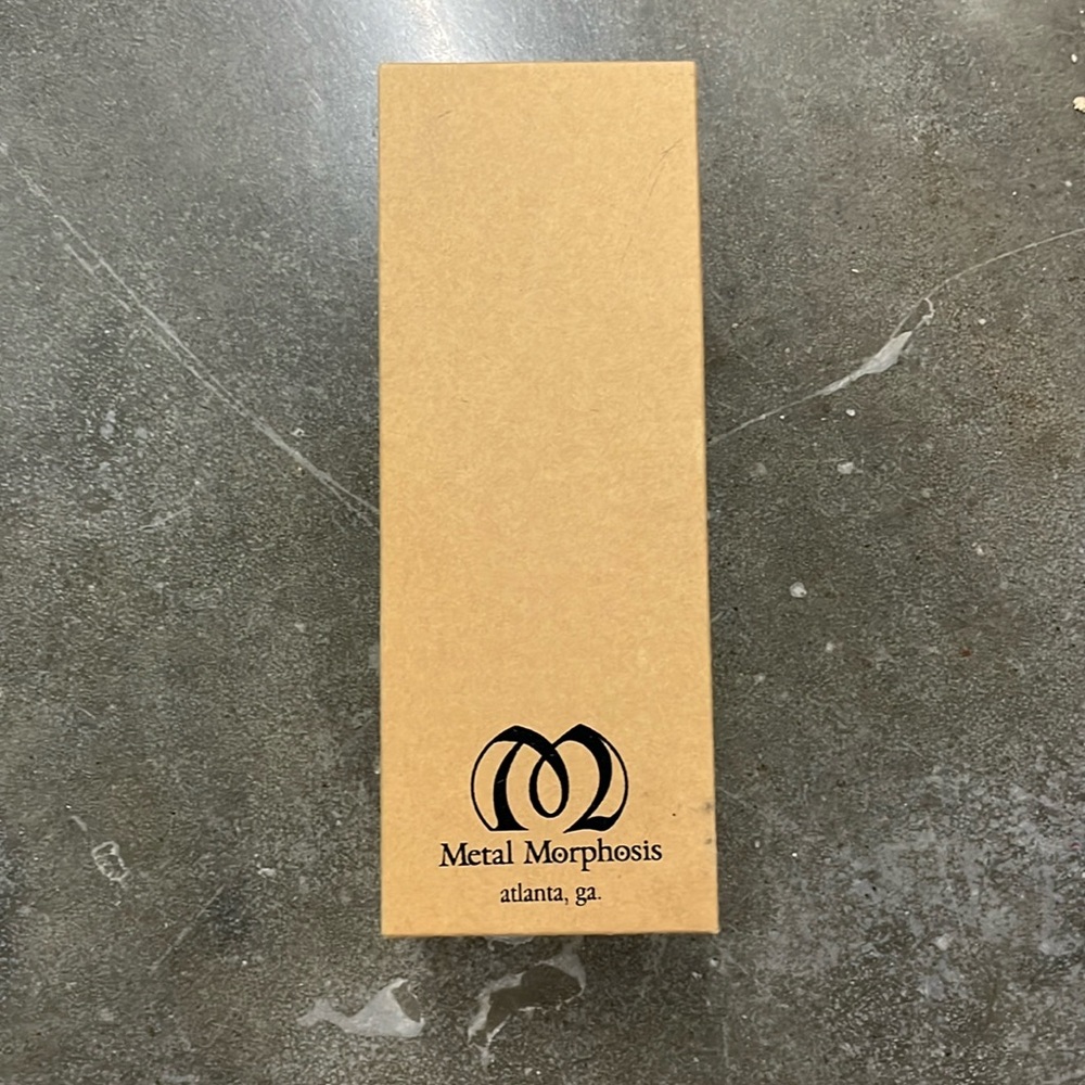 Metal Morphosis handmade silver candle snuffer.